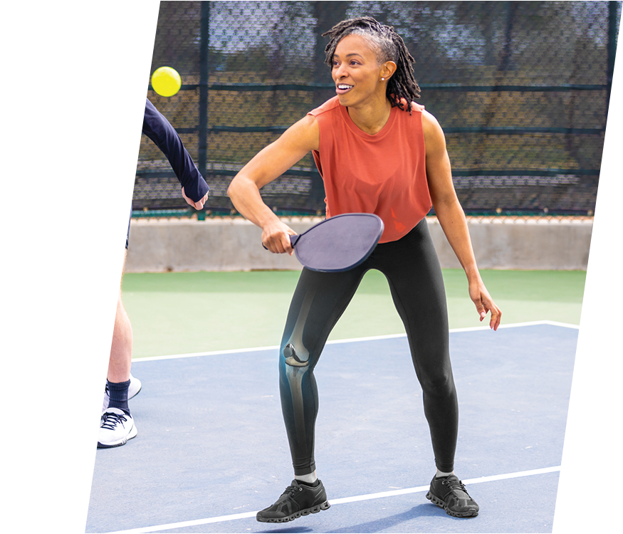 Girl holding pickleball paddle